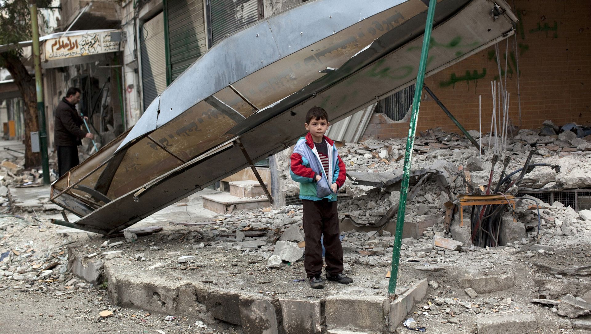 In this Monday, Feb. 27, 2012 file photo, a boy stands in from of a shop destroyed in Syrian Army shelling in the center of Idlib, in northern Syria. In this Monday, Feb. 27, 2012 file photo, a boy stands in from of a shop destroyed in Syrian Army shelling in the center of Idlib, in northern Syria. - Sputnik International, 1920, 25.05.2021