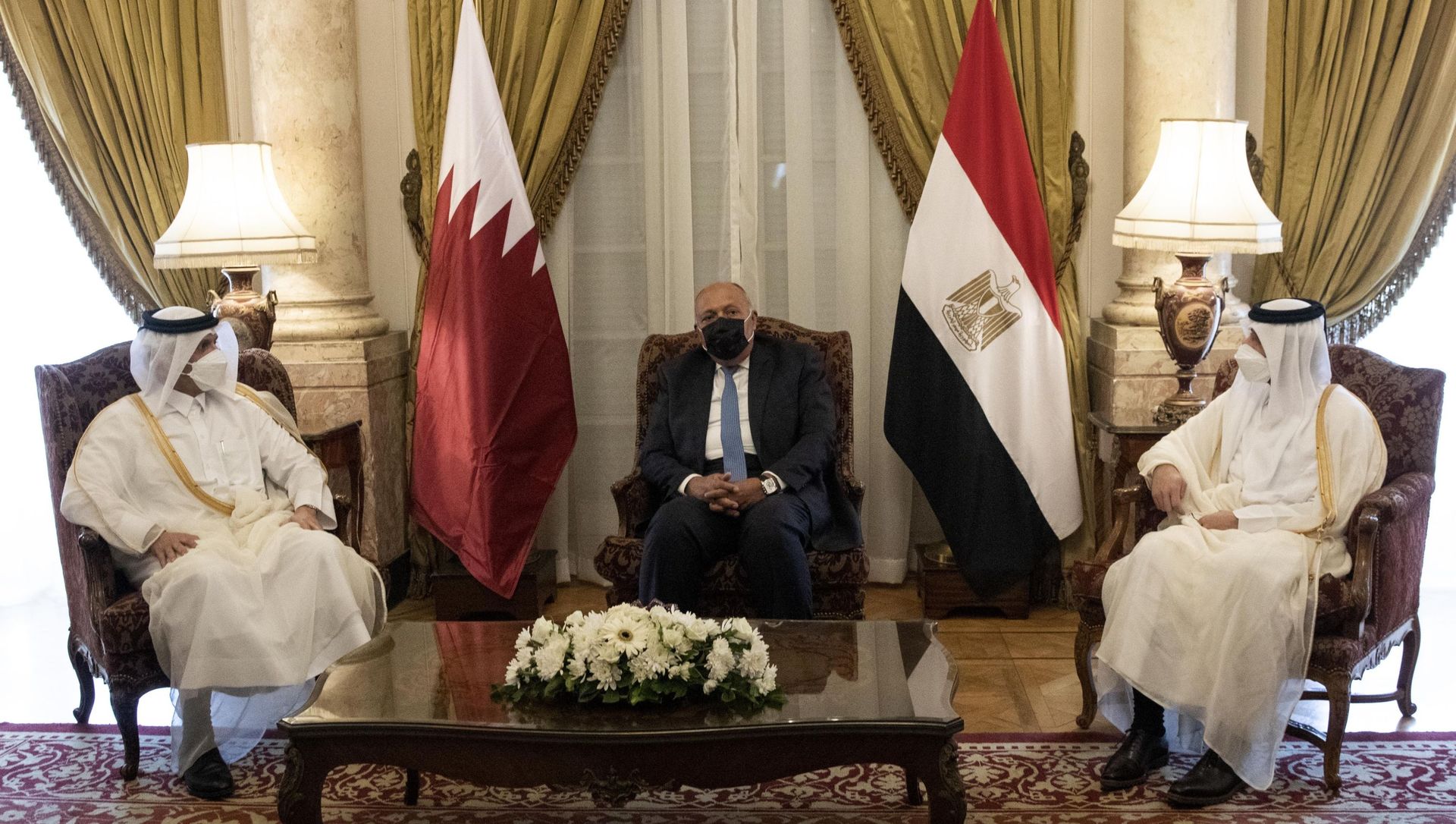 Qatar's Deputy Prime Minister and Foreign Minister Sheikh Mohammed bin Abdulrahman bin Jassim Al-Thani, left, meets with Egyptian Foreign Minister Sameh Shoukry, center, at the Tahrir Palace in Cairo, Egypt, Tuesday, May 25, 2021 Qatar's Deputy Prime Minister and Foreign Minister Sheikh Mohammed bin Abdulrahman bin Jassim Al-Thani, left, meets with Egyptian Foreign Minister Sameh Shoukry, center, at the Tahrir Palace in Cairo, Egypt, Tuesday, May 25, 2021 - Sputnik International, 1920, 26.05.2021