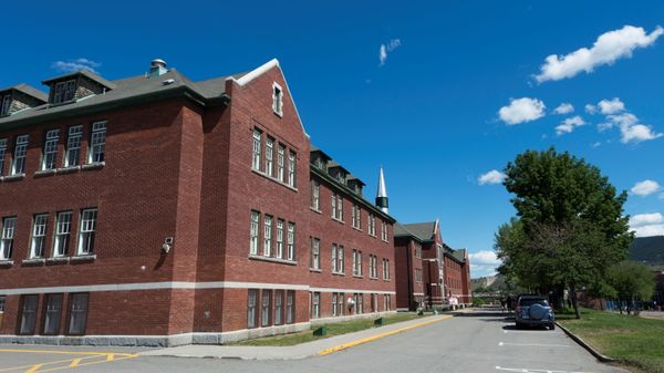The former Kamloops Indian Residential School is pictured, after the remains of 215 children, some as young as three years old, were found at the site, in Kamloops, British Columbia, Canada May 29, 2021. - Sputnik International