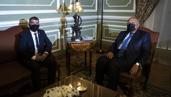 Egyptian Foreign Minister Sameh Shoukry, right, meets with Israeli Foreign Minister Gabi Ashkenazi, at the Tahrir Palace in Cairo, Egypt, Sunday, May 30, 2021. - Sputnik International