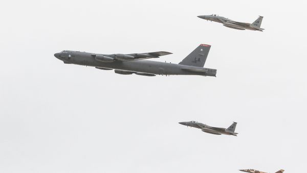 A U.S. B-52 Stratofortress bomber and two F-18 Hornets are accompanied by a Moroccan F-5 Tiger II fighter jet over an impact range near Tan Tan, Morocco, April 20, 2018.  - Sputnik International