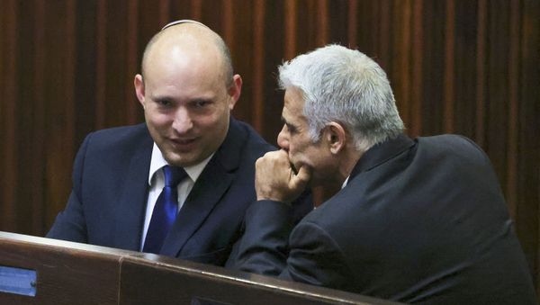 Israel's Yamina party leader, Naftali Bennett (L), smiles as he speaks to Yesh Atid party leader, Yair Lapid, during a special session of the Knesset, Israel's parliament, to elect a new president, in Jerusalem on June 2, 2021. - Israeli politicians battling to unseat veteran right-wing Prime Minister Benjamin Netanyahu were locked in last-ditch talks on today to hammer out their change coalition composed of bitter ideological rivals. Netanyahu's opponents have until the end of the day -- 11:59 pm (2059 GMT) -- to cobble together an administration that would end 12 straight years of rule by the hawkish heavyweight, Israel's longest-ruling premier.  - Sputnik International