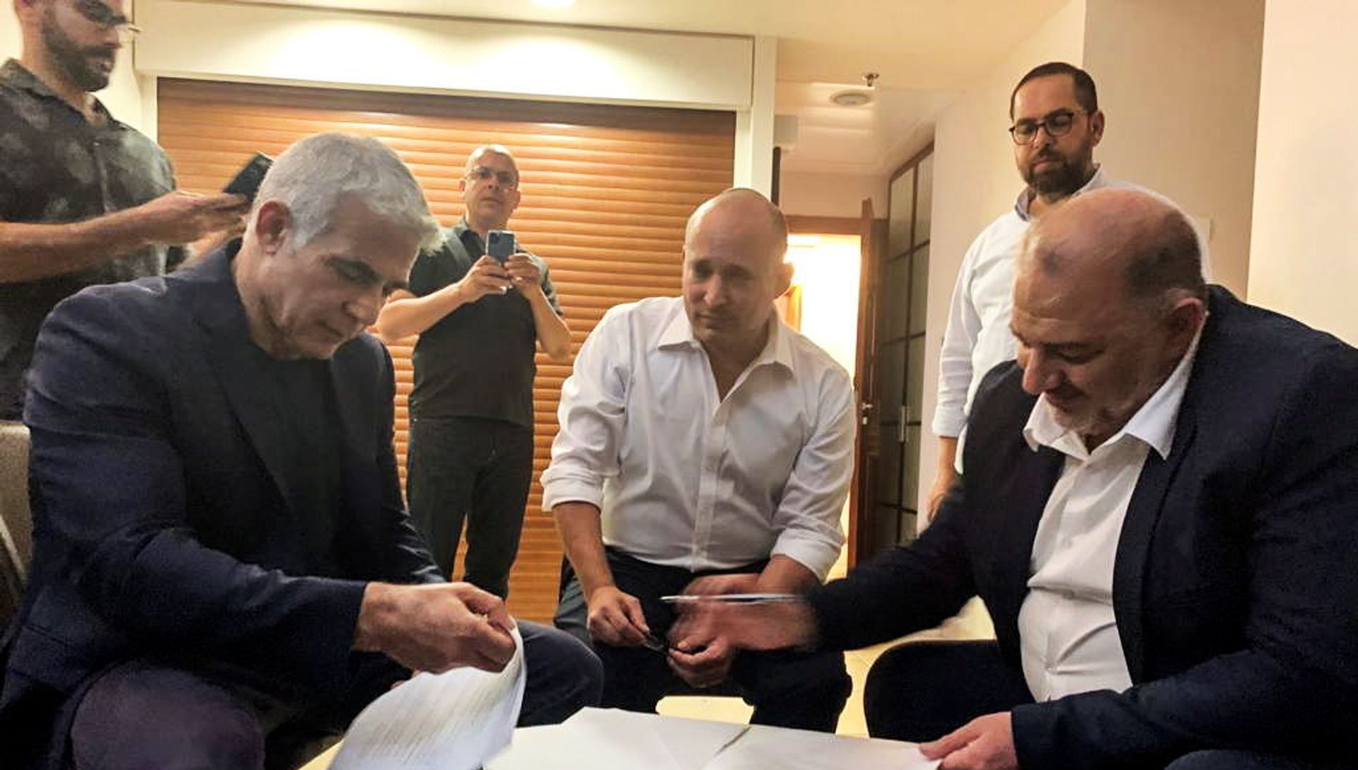 United Arab List party leader Mansour Abbas, Yamina party leader Naftali Bennett and Yesh Atid party leader Yair Lapid, sit together in Ramat Gan, near Tel Aviv, Israel June 2, 2021. Picture taken June 2, 2021 United Arab List party leader Mansour Abbas, Yamina party leader Naftali Bennett and Yesh Atid party leader Yair Lapid, sit together in Ramat Gan, near Tel Aviv, Israel June 2, 2021. Picture taken June 2, 2021 - Sputnik International, 1920, 11.06.2021