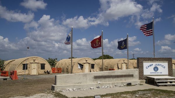 In this April 18, 2019, file photo, in this photo reviewed by U.S. military officials, flags fly in front of the tents of Camp Justice in Guantanamo Bay Naval Base, Cuba. - Sputnik International