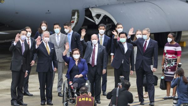 Taiwan's Foreign Minister Joseph Wu, fourth from right, waves with U.S. senators to his right Democratic Sen. Christopher Coons of Delaware, a member of the Foreign Relations Committee, Democratic Sen. Tammy Duckworth of Illinois and Republican Sen. Dan Sullivan of Alaska, members of the Armed Services Committee on their arrival at the Songshan Airport in Taipei, Taiwan on Sunday, June 6, 2021 - Sputnik International