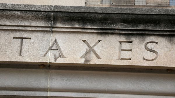 The word taxes is seen engraved at the headquarters of the Internal Revenue Service (IRS) in Washington, D.C., U.S., May 10, 2021. - Sputnik International