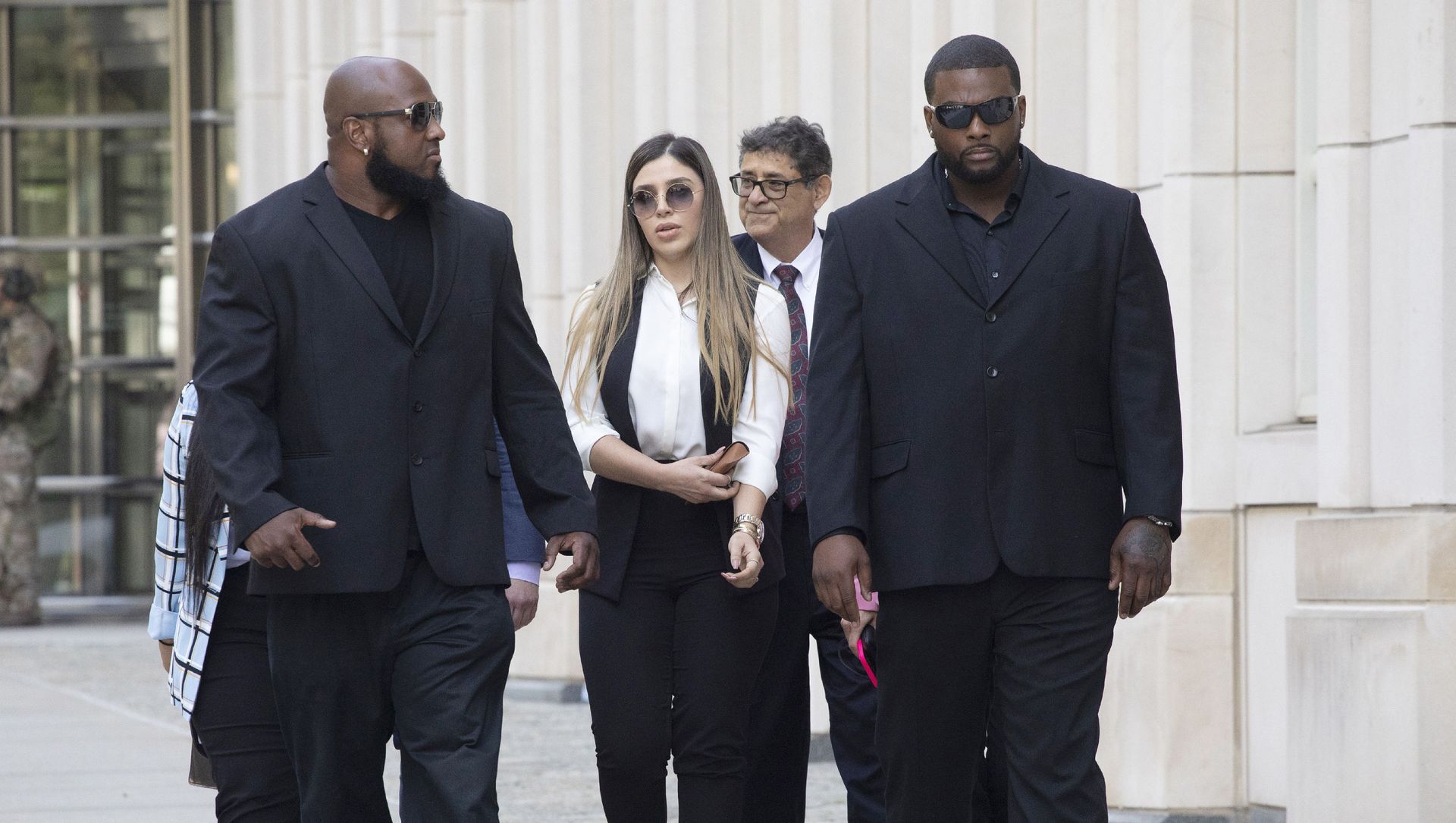 In this July 17, 2019 file photo, New York City police officer Ishmael Bailey, right, moonlights as a bodyguard for Emma Coronel Aispuro, wife of Mexican drug lord Joaquin El Chapo Guzman, as they leave Brooklyn federal court in New York, following Guzman's sentencing. In this July 17, 2019 file photo, New York City police officer Ishmael Bailey, right, moonlights as a bodyguard for Emma Coronel Aispuro, wife of Mexican drug lord Joaquin El Chapo Guzman, as they leave Brooklyn federal court in New York, following Guzman's sentencing. - Sputnik International, 1920, 09.06.2021