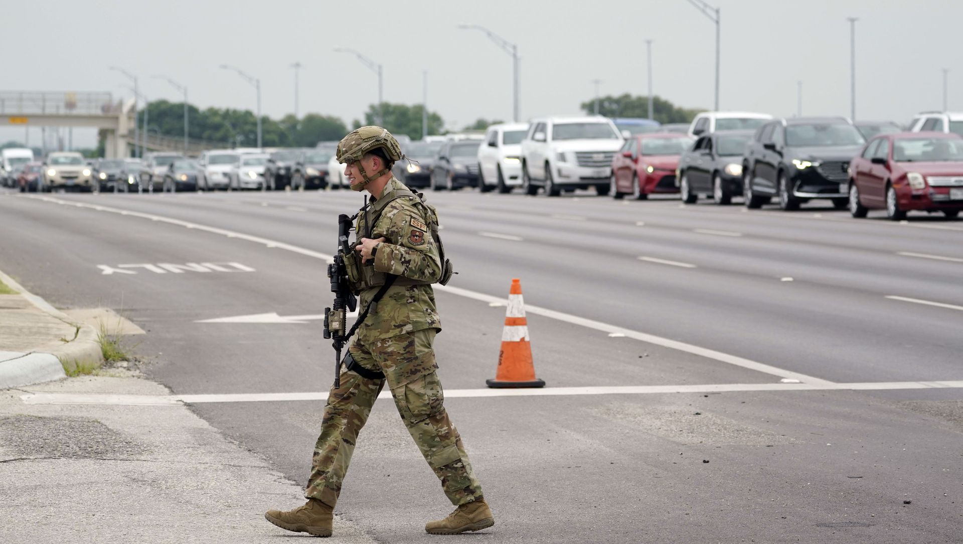 A military policeman walks past traffic outside of a JBSA-Lackland Air Force Base gate, Wednesday, June 9, 2021, in San Antonio. The Air Force was put on lockdown as police and military officials say they searched for two people suspected of shooting into the base from outside. A military policeman walks past traffic outside of a JBSA-Lackland Air Force Base gate, Wednesday, June 9, 2021, in San Antonio. The Air Force was put on lockdown as police and military officials say they searched for two people suspected of shooting into the base from outside. - Sputnik International, 1920, 10.06.2021