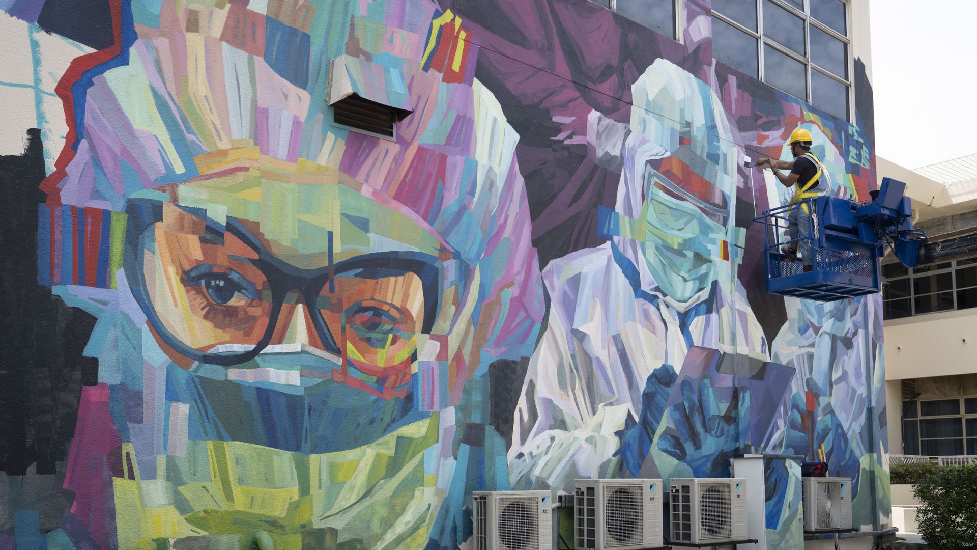 A worker gives final touches to a graffiti that tributes to Malaysian workers on the frontline against the COVID-19 pandemic outside a hospital in Kuala Lumpur, Malaysia, Friday, Jan. 29, 2021 A worker gives final touches to a graffiti that tributes to Malaysian workers on the frontline against the COVID-19 pandemic outside a hospital in Kuala Lumpur, Malaysia, Friday, Jan. 29, 2021 - Sputnik International, 1920, 10.06.2021