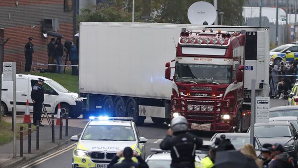 In this Wednesday Oct. 23, 2019 file photo, police escort the truck, that was found to contain a large number of dead bodies, as they move it from an industrial estate in Thurrock, south England - Sputnik International