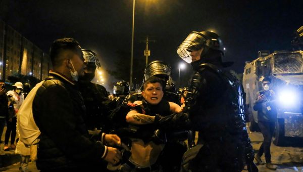 A demonstrator is trying to prevent a fellow demonstrator to be detained by police during protests for policy reforms and against the government, in Bogota, Colombia May 21, 2021. Picture taken May 21, 2021. A demonstrator is trying to prevent a fellow demonstrator to be detained by police during protests for policy reforms and against the government, in Bogota, Colombia May 21, 2021. Picture taken May 21, 2021. - Sputnik International