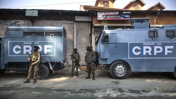 Indian Central Reserve Police Force (CRPF) soldiers guard during a gunfight between Indian government forces and suspected rebels in Srinagar, Indian controlled Kashmir, Monday, Oct. 12, 2020 - Sputnik International