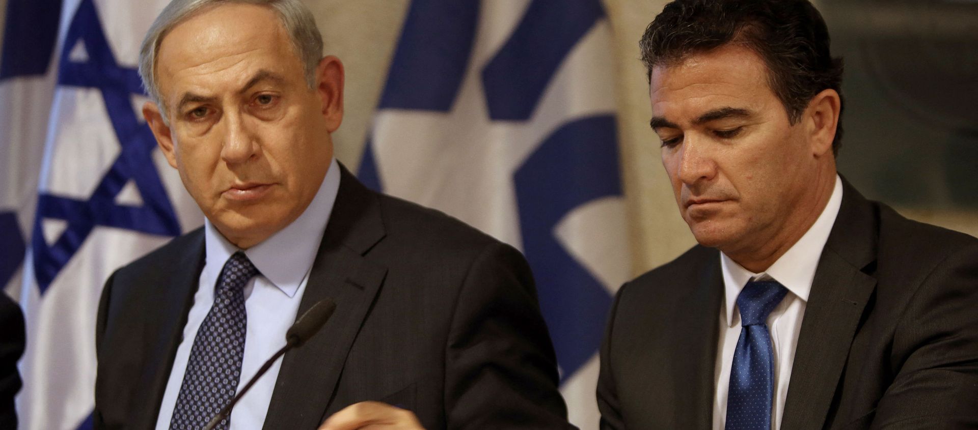 A file picture taken at the Israeli foreign ministry on October 15, 2015, shows Prime Minister Benjamin Netanyahu (L) sitting next to Yossi Cohen, who is currently the head of Israel's National Security Council, and who was named as the 12th head of the Mossad intelligence agency by Netanyahu on December 7, 2015. - Sputnik International, 1920, 12.06.2021