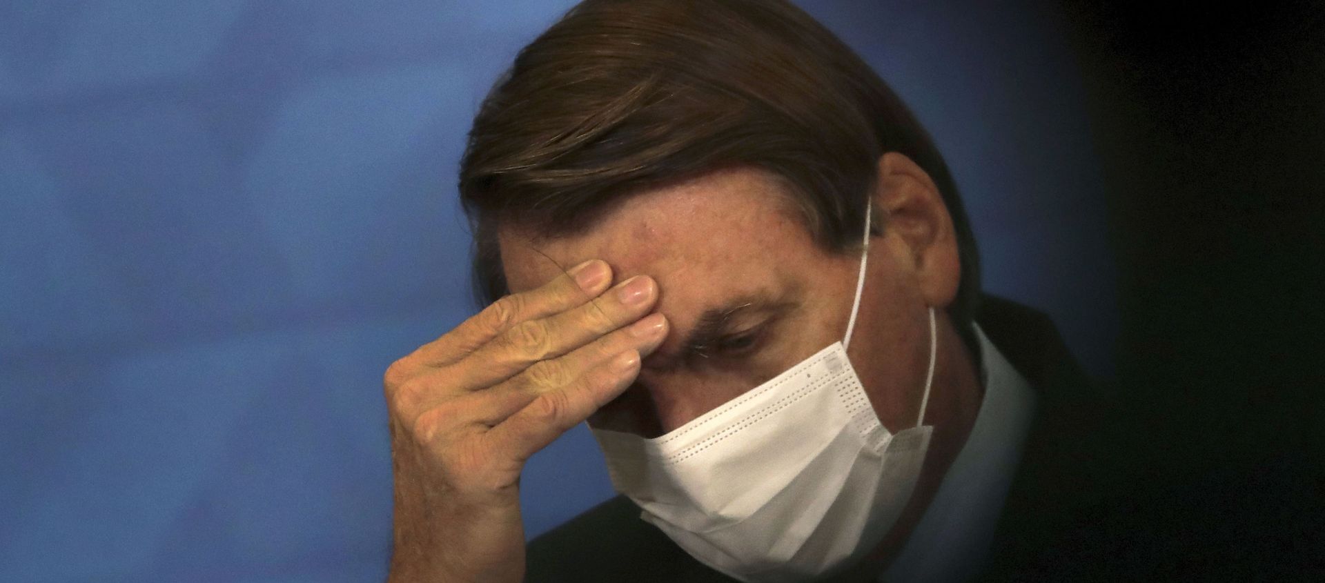 Brazil's President Jair Bolsonaro, wearing protective face mask, listens during a ceremony announcing economic measures to support philanthropic hospitals and help them treat COVID-19 patients, at the Planalto Presidential Palace, in Brasilia, Brazil, Thursday, March 25, 2021. - Sputnik International, 1920, 02.07.2021