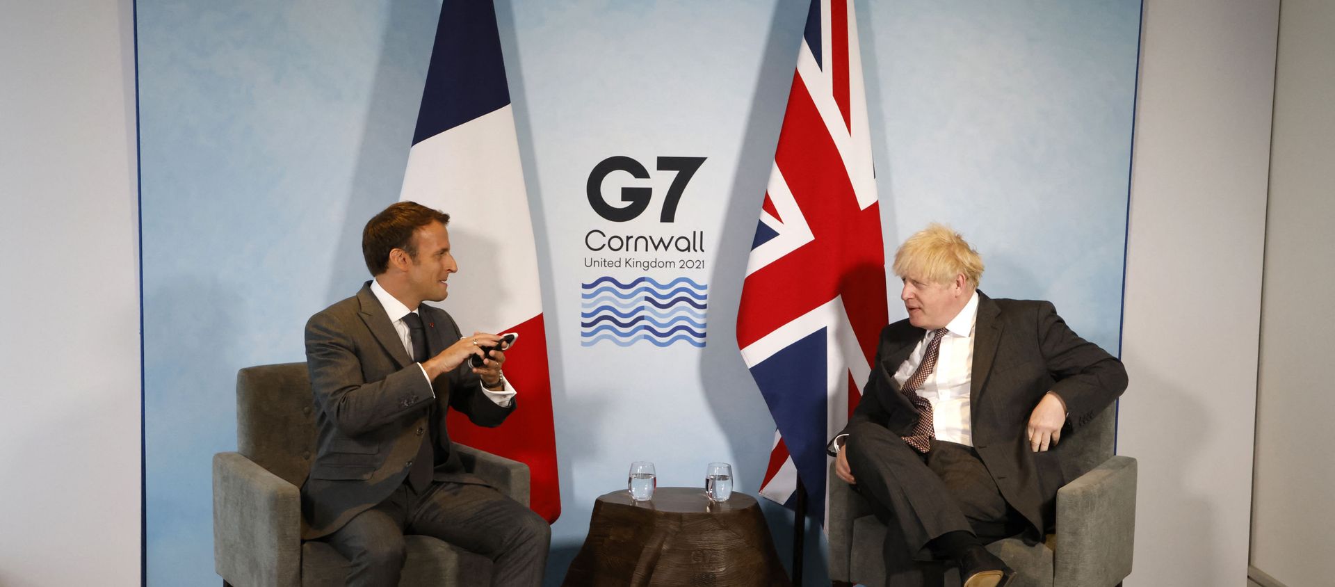 Britain's Prime Minister Boris Johnson and France's President Emmanuel Macron take part in a bilateral meeting during the G7 summit in Carbis bay, Cornwall on June 12, 2021.  - Sputnik International, 1920, 13.06.2021