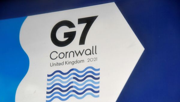 A G7 logo is seen on an information sign near the Carbis Bay hotel resort, where an in-person G7 summit of global leaders is due to take place in June, St Ives, Cornwall, southwest Britain May 24, 2021. Picture taken May 24, 2021.  - Sputnik International