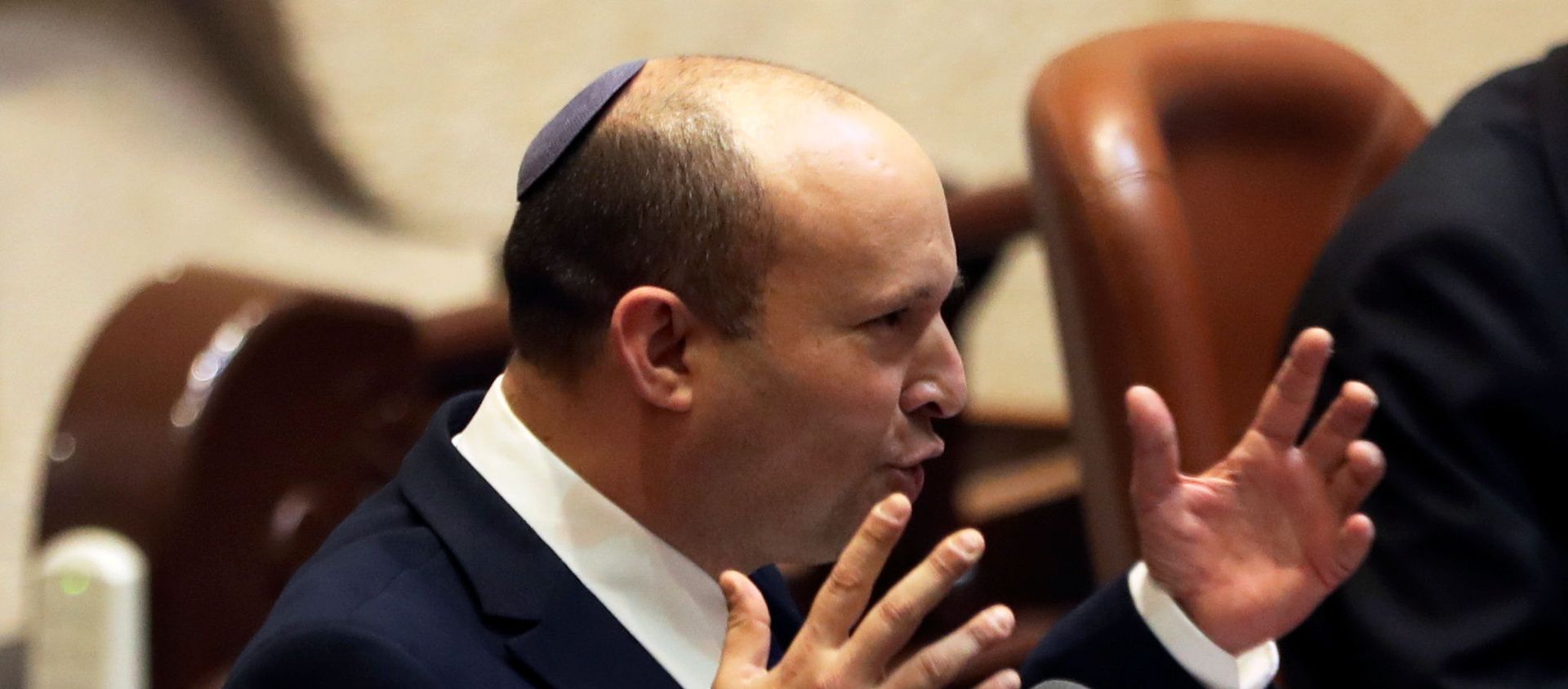 Naftali Bennett, Prime Minister-designate, gestures as he speaks at the Knesset, Israel's parliament, during a special session whereby a confidence vote will be held to approve and swear-in a new coalition government, in Jerusalem June 13, 2021. Naftali Bennett, Prime Minister-designate, gestures as he speaks at the Knesset, Israel's parliament, during a special session whereby a confidence vote will be held to approve and swear-in a new coalition government, in Jerusalem June 13, 2021. - Sputnik International, 1920