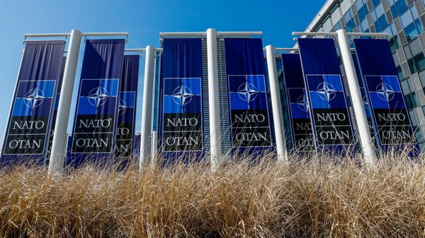 FILE PHOTO: Banners displaying the NATO logo are placed at the entrance of new NATO headquarters during the move to the new building, in Brussels, Belgium April 19, 2018.  REUTERS/Yves Herman/File Photo - Sputnik International