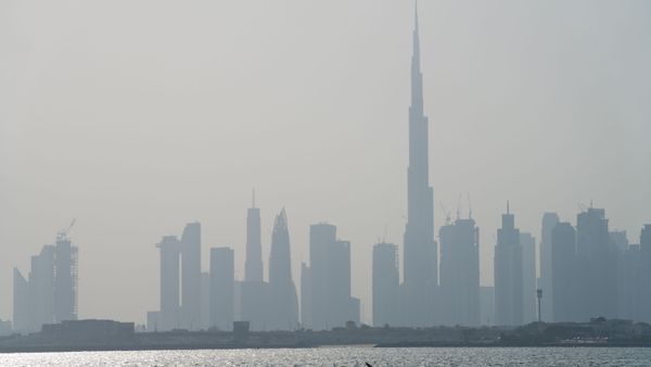 Kayakers race in front of the Burj Khalifa, the world's tallest building, off the coast of Dubai, United Arab Emirates, Friday, June 19, 2020 - Sputnik International