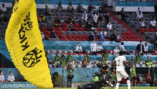 Soccer Football - Euro 2020 - Group F - France v Germany - Football Arena Munich, Munich, Germany - June 15, 2021 A Greenpeace protestor on the pitch before the match - Sputnik International