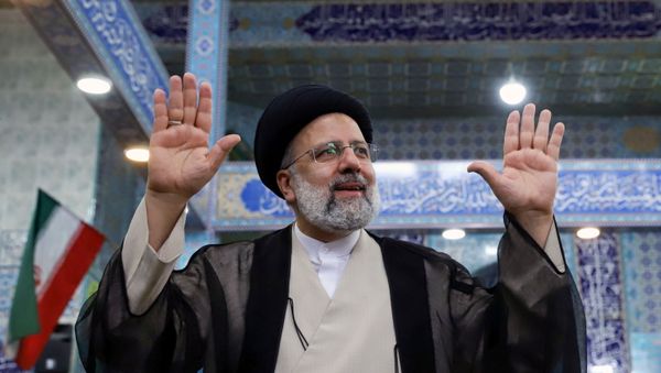 Presidential candidate Ebrahim Raisi gestures after casting his vote during presidential elections at a polling station in Tehran, Iran June 18, 2021. Majid Asgaripour/WANA (West Asia News Agency) Presidential candidate Ebrahim Raisi gestures after casting his vote during presidential elections at a polling station in Tehran, Iran June 18, 2021. Majid Asgaripour/WANA (West Asia News Agency) - Sputnik International