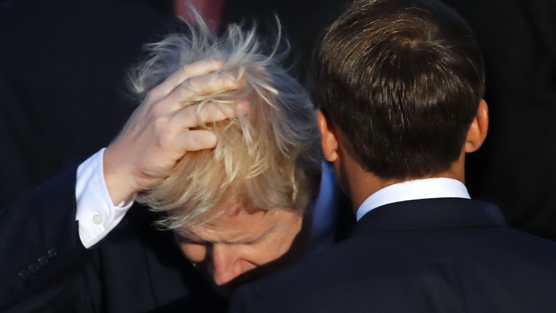 Britain's Prime Minister Boris Johnson touches his hair beside French President Emmanuel Macron during the G7 family photo on Sunday, 25 August 2019 in Biarritz. Britain's Prime Minister Boris Johnson touches his hair beside French President Emmanuel Macron during the G7 family photo on Sunday, 25 August 2019 in Biarritz. - Sputnik International, 1920, 21.06.2021