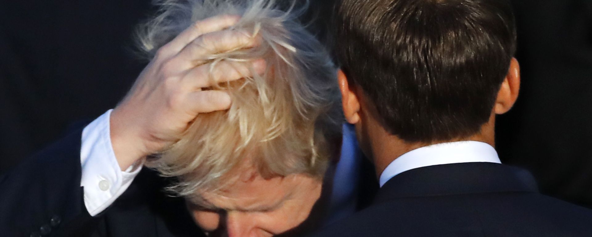 Britain's Prime Minister Boris Johnson touches his hair beside French President Emmanuel Macron during the G7 family photo Sunday, Aug. 25, 2019 in Biarritz Britain's Prime Minister Boris Johnson touches his hair beside French President Emmanuel Macron during the G7 family photo Sunday, Aug. 25, 2019 in Biarritz - Sputnik International, 1920, 20.09.2021