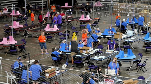 FILE - In this May 6, 2021 file photo, Maricopa County ballots cast in the 2020 general election are examined and recounted by contractors working for Florida-based company, Cyber Ninjas at Veterans Memorial Coliseum in Phoenix. For some conspiracy theorists, the 2020 election still hasn’t ended. Trump supporters are pushing to re-examine ballots from November across the country, and finding success in swing states like Arizona and Georgia. Their efforts and sometimes misleading conclusions are being gleefully amplified by the former president. FILE - In this May 6, 2021 file photo, Maricopa County ballots cast in the 2020 general election are examined and recounted by contractors working for Florida-based company, Cyber Ninjas at Veterans Memorial Coliseum in Phoenix. For some conspiracy theorists, the 2020 election still hasn’t ended. Trump supporters are pushing to re-examine ballots from November across the country, and finding success in swing states like Arizona and Georgia. Their efforts and sometimes misleading conclusions are being gleefully amplified by the former president. - Sputnik International