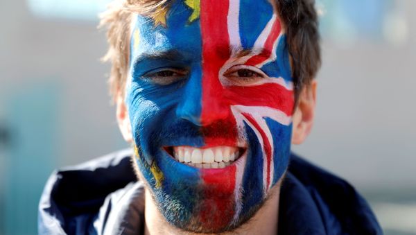 FILE PHOTO: An anti-Brexit activist demonstrates as British Prime Minister Theresa May and German Chancellor Angela Merkel meet to discuss Brexit, at the chancellery in Berlin, Germany, April 9, 2019 - Sputnik International