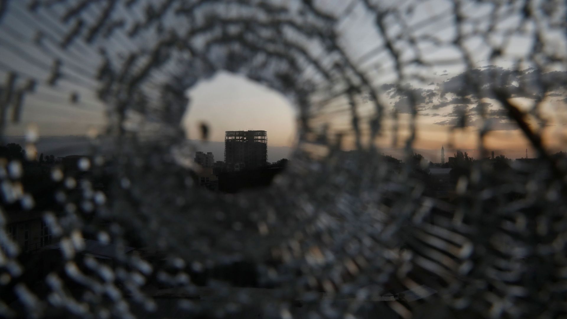 A building is seen through a bullet hole in a window of the Africa Hotel in the town of Shire, Tigray region, Ethiopia, March 16, 2021. Picture taken March 16, 2021 A building is seen through a bullet hole in a window of the Africa Hotel in the town of Shire, Tigray region, Ethiopia, March 16, 2021. Picture taken March 16, 2021 - Sputnik International, 1920, 23.06.2021