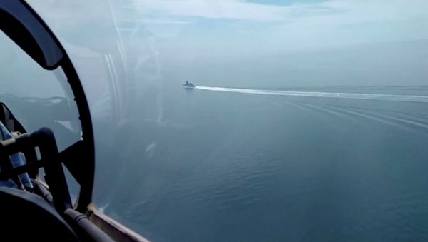 A still image taken from a video released by Russia's Defence Ministry allegedly shows British Royal Navy's Type 45 destroyer HMS Defender filmed from a Russian military aircraft in the Black Sea, June 23, 2021. - Sputnik International