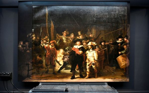 Rembrandt's famed Night Watch is seen back on display for the first time in 300 years, in what researchers say is its original size, with missing parts temporarily restored in an exhibition aided by artificial intelligence at Rijksmuseum in Amsterdam, Netherlands June 23, 2021. Rembrandt's famed Night Watch is seen back on display for the first time in 300 years, in what researchers say is its original size, with missing parts temporarily restored in an exhibition aided by artificial intelligence at Rijksmuseum in Amsterdam, Netherlands June 23, 2021. - Sputnik International