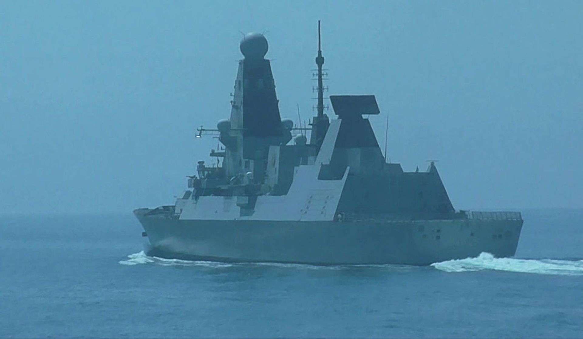 British Navy's Defender destroyer sails in the Black Sea near the Cape Fiolent after entering Russia's territorial waters, in Crimea, Russia - Sputnik International, 1920, 07.09.2021