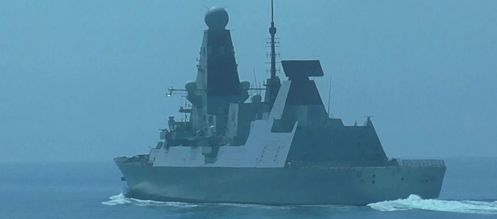 British Navy's Defender destroyer sails in the Black Sea near the Cape Fiolent after entering Russia's territorial waters, in Crimea, Russia British Navy's Defender destroyer sails in the Black Sea near the Cape Fiolent after entering Russia's territorial waters, in Crimea, Russia - Sputnik International, 1920, 25.06.2021