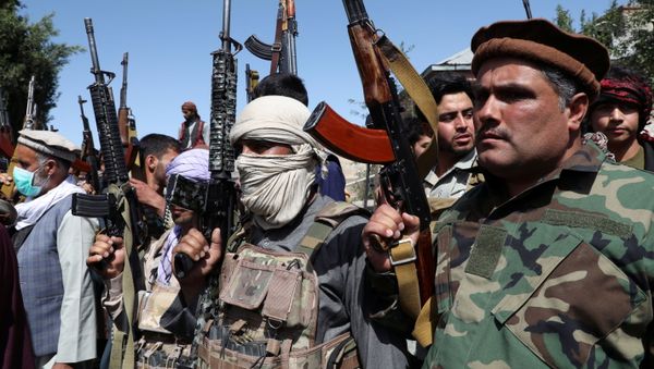 Armed men attend a gathering to announce their support for Afghan security forces and that they are ready to fight against the Taliban, on the outskirts of Kabul, Afghanistan June 23, 2021. - Sputnik International