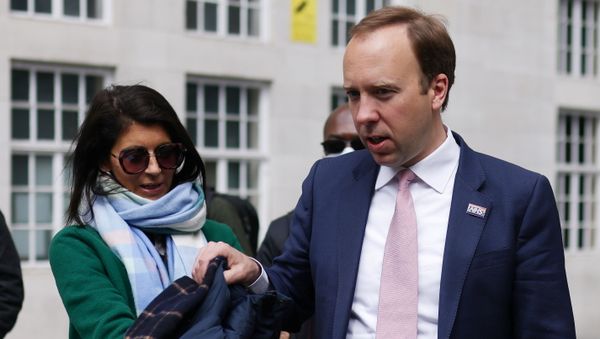Britain's Health Secretary Matt Hancock hands his coat to his aide Gina Coladangelo (L) before a television interview outside BBC's Broadcasting House in London, Britain, May 16, 2021 - Sputnik International