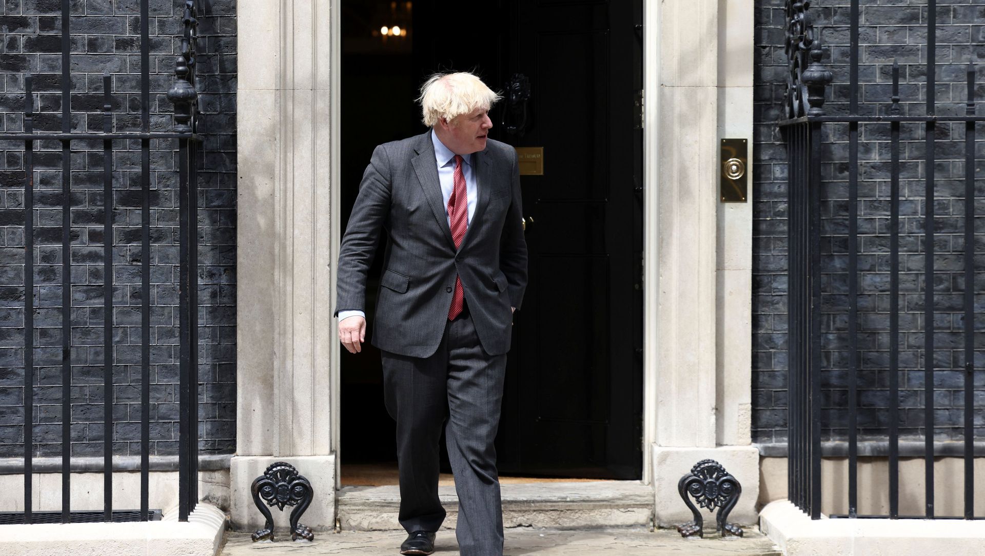 Britain's Prime Minister Boris Johnson walks at Downing Street in London Britain's Prime Minister Boris Johnson walks at Downing Street in London - Sputnik International, 1920, 27.06.2021