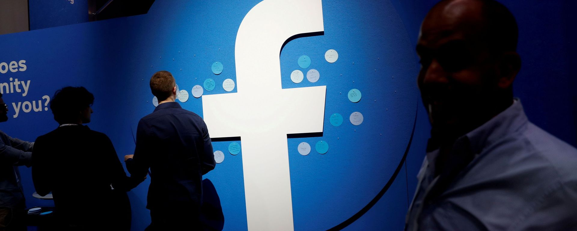 Attendees walk past a Facebook logo during Facebook Inc's F8 developers conference in San Jose Attendees walk past a Facebook logo during Facebook Inc's F8 developers conference in San Jose - Sputnik International, 1920, 15.09.2021