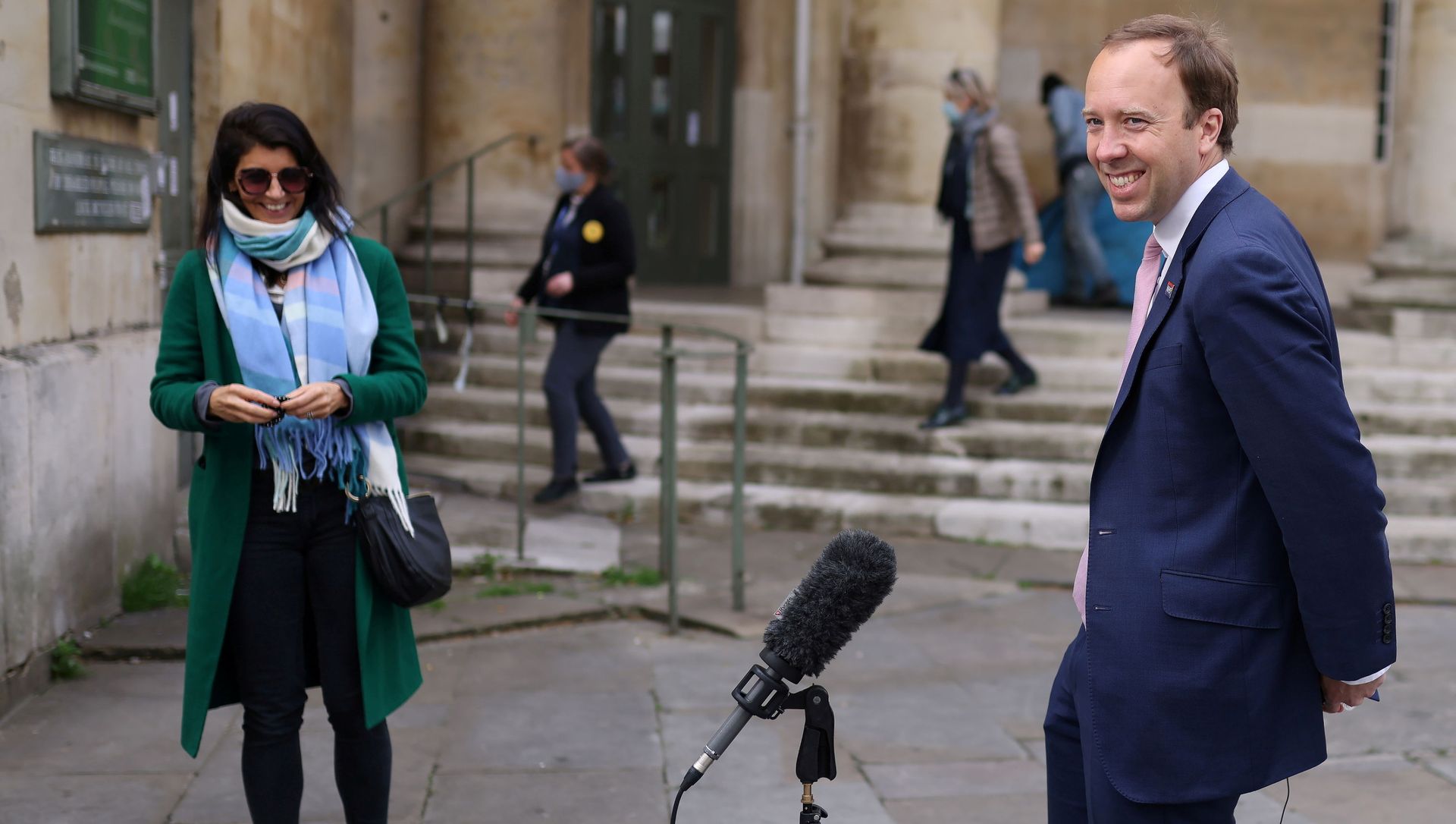Britain's Health Secretary Matt Hancock smiles during a television interview as his aide Gina Coladangelo looks on, outside BBC's Broadcasting House in London Britain's Health Secretary Matt Hancock smiles during a television interview as his aide Gina Coladangelo looks on, outside BBC's Broadcasting House in London - Sputnik International, 1920, 29.06.2021