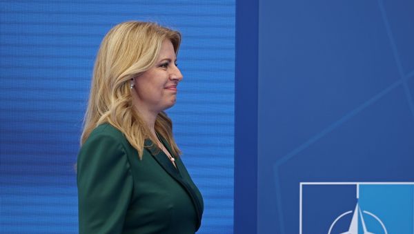 Slovakia's President Zuzana Caputova arrives to pose with NATO Secretary General Jens Stoltenberg (not pictured) during the NATO summit at the Alliance's headquarters, in Brussels, Belgium, June 14, 2021. Kenzo Tribouillard/Pool via REUTERS - Sputnik International