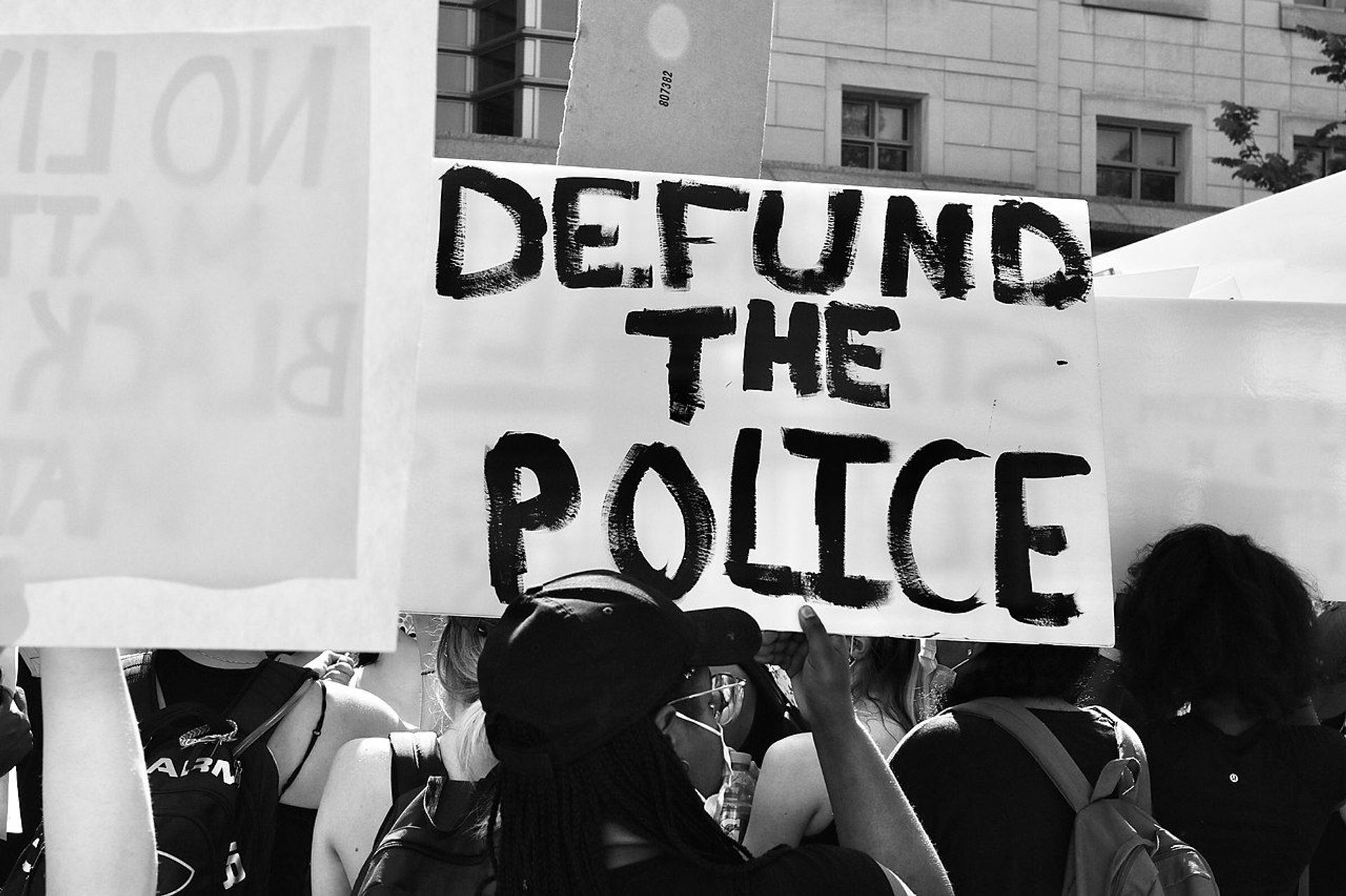 Demonstrator at a George Floyd protest holding up a Defund the Police sign on June 5 2020 Demonstrator at a George Floyd protest holding up a Defund the Police sign on June 5 2020 - Sputnik International, 1920, 07.09.2021