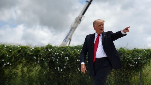 Former U.S. President Donald Trump exits the stage after visiting an unfinished section of the wall along the U.S.-Mexico border with Texas Governor Greg Abbott in Pharr, Texas, U.S. June 30, 2021.  - Sputnik International