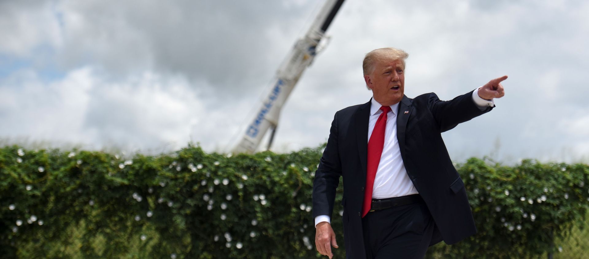 Former U.S. President Donald Trump exits the stage after visiting an unfinished section of the wall along the U.S.-Mexico border with Texas Governor Greg Abbott in Pharr, Texas, U.S. June 30, 2021.  - Sputnik International, 1920, 01.07.2021