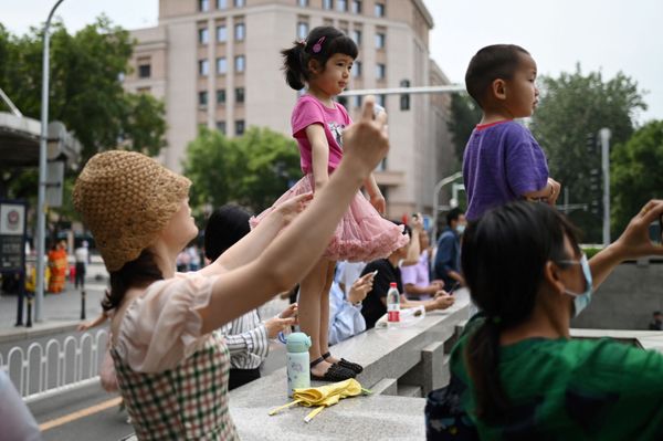 Kids are watching grand parade as the second largest party in the world is getting ready to step into the next century of its activities.  - Sputnik International