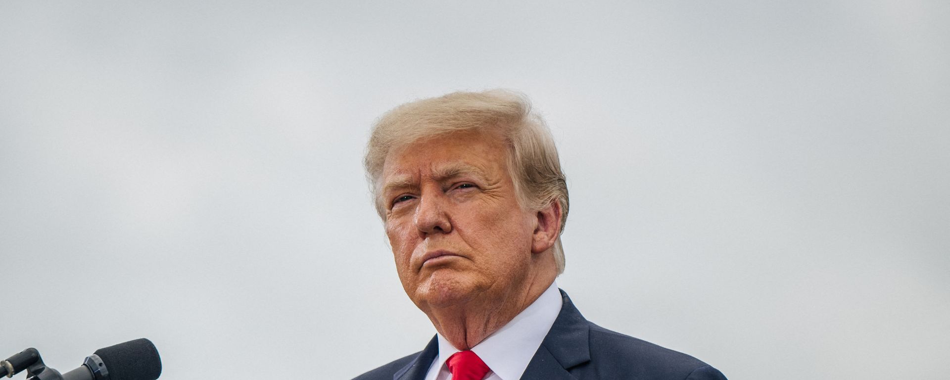Former President Donald Trump looks on before speaking during a tour to an unfinished section of the border wall on June 30, 2021 in Pharr, Texas. Gov. Abbott has pledged to build a state-funded border wall between Texas and Mexico as a surge of mostly Central American immigrants crossing into the United States has challenged U.S. immigration agencies. So far in 2021, U.S. Border Patrol agents have apprehended more than 900,000 immigrants crossing into the United States on the southern border.  - Sputnik International, 1920, 31.08.2021