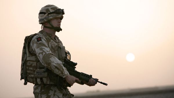 British soldier Captain Roger Walker from Air Operation Officer Battalion headquarters 1st Batalion The Royal Welsh together with US soldiers (not seen) from Bravo Company 1-508 Parachute Infantry Regiment 82nd Airborne Division search for Taliban insurgents in the village of Biabanak, Kandahar province,some 400 km south west of Kabul, 02 July 2007. Biabanak village is situated on the border line of Kandahar and Helmand Province - Sputnik International