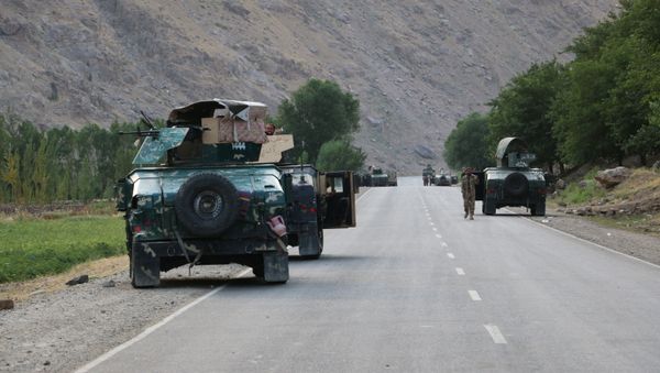 Afghan soldiers pause on a road at the front line of fighting between Taliban and Security forces, near the city of Badakhshan, northern Afghanistan, Sunday, July. 4, 2021. - Sputnik International