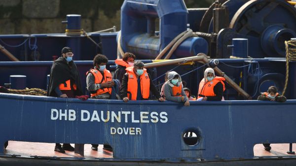 Waleed (3L), 29, a Kuwaiti migrant, stands with other migrants onboard the DHB Dauntless tug boat as they are brought to shore by the UK Border Force after illegally crossing the English Channel from France on a dinghy on September 11, 2020, in the marina at Dover, on the south coast of England - Sputnik International