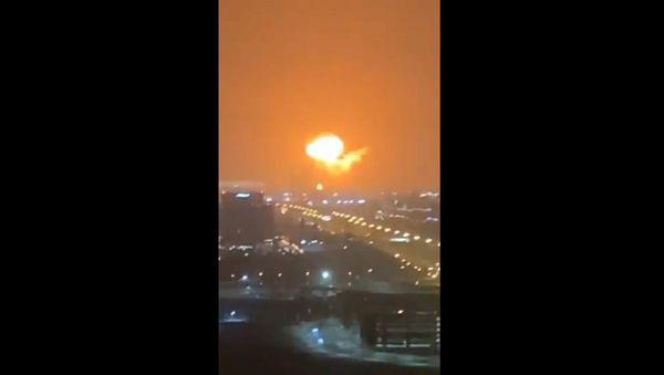Screenshot captures the moment in which a massive fire broke out on a container ship docked at Dubai's Jebel Ali commercial port in the United Arab Emirates. - Sputnik International