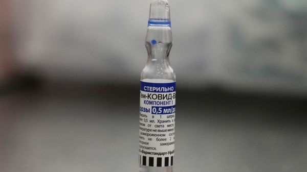 A vial with Russia's Sputnik V coronavirus vaccine is placed on a table in a medical room at a vaccination center in the GUM, State Department store, in Red Square in Moscow, Russia, Thursday, July 1, 2021. - Sputnik International